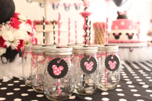 Minnie Mouse Mason Jars! Pick up rubber grommets at your local hardware store that have an opening of 5/16". That opening fits the average straw size. Drill a hole in the top of the lid and insert grommet. Don't forget to put a small air hole in the lid as well :)